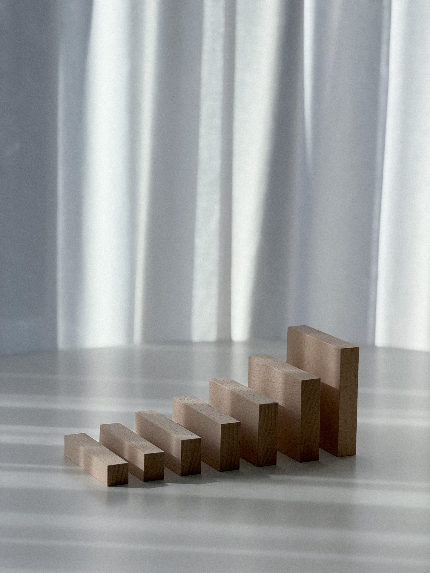Portrait view of the growing sequence of wooden blocks.