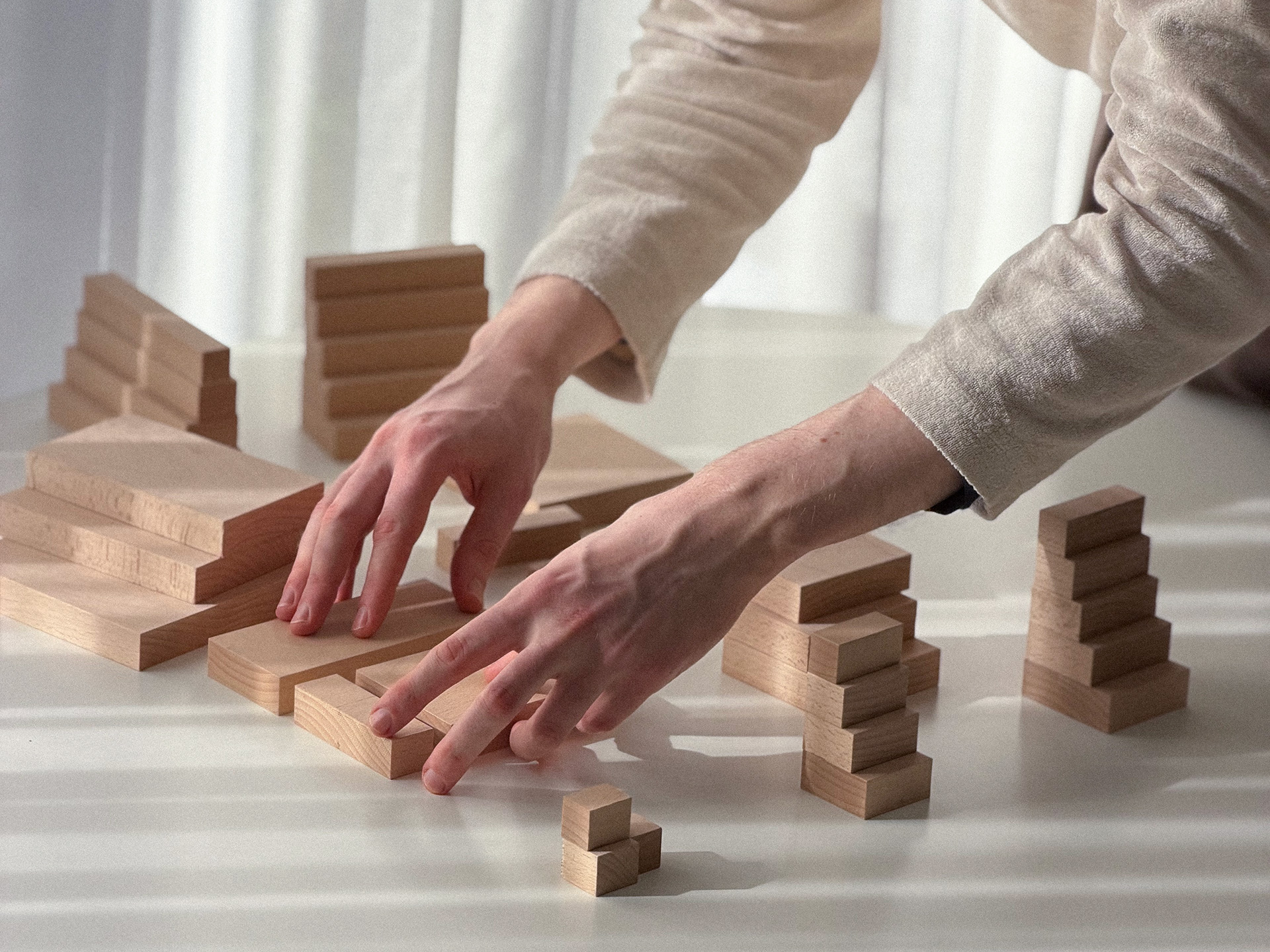 Arrangement of many wooden blocks forming a stepped composition.