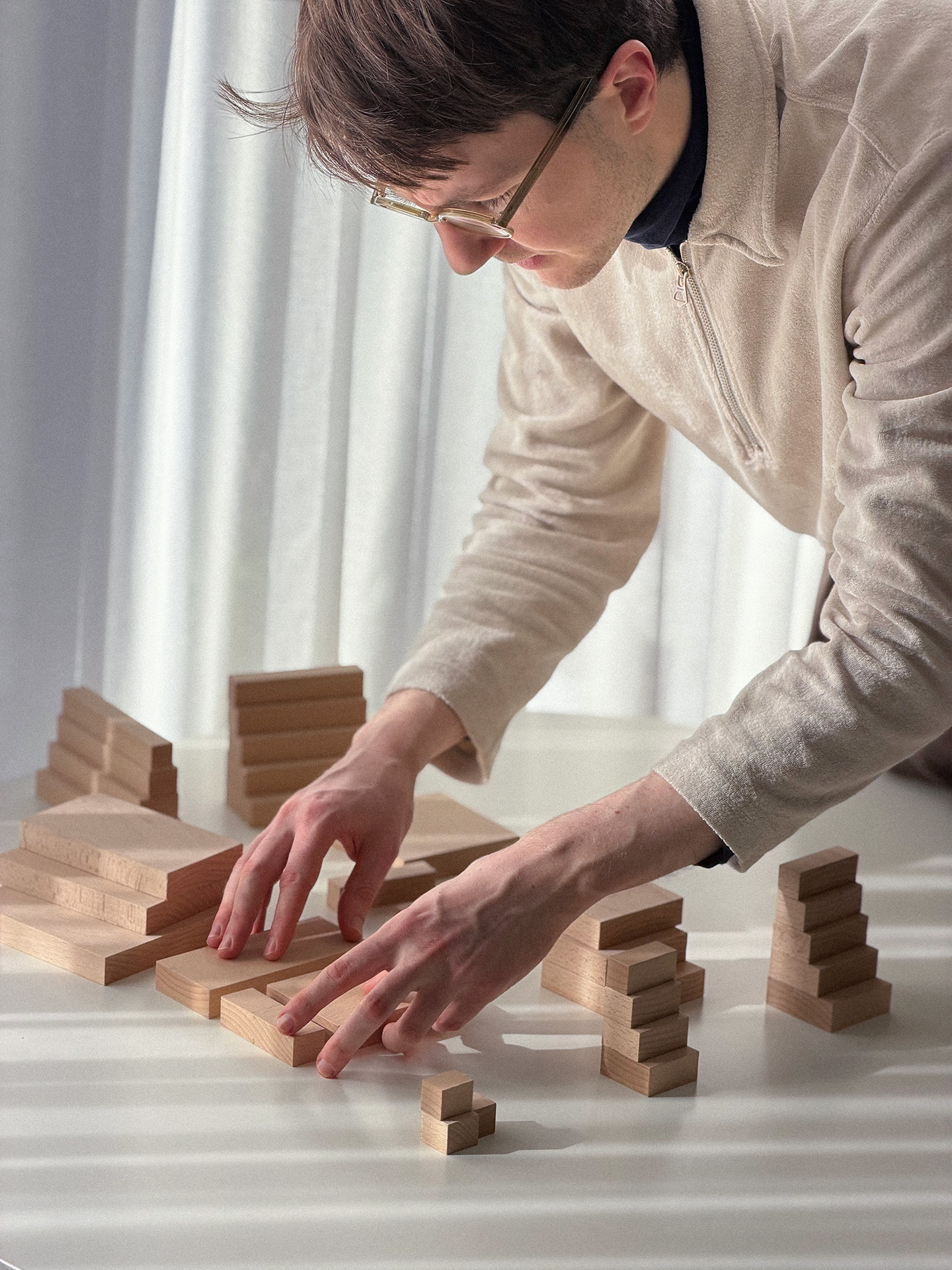 Portrait view of the stepped wooden block composition.